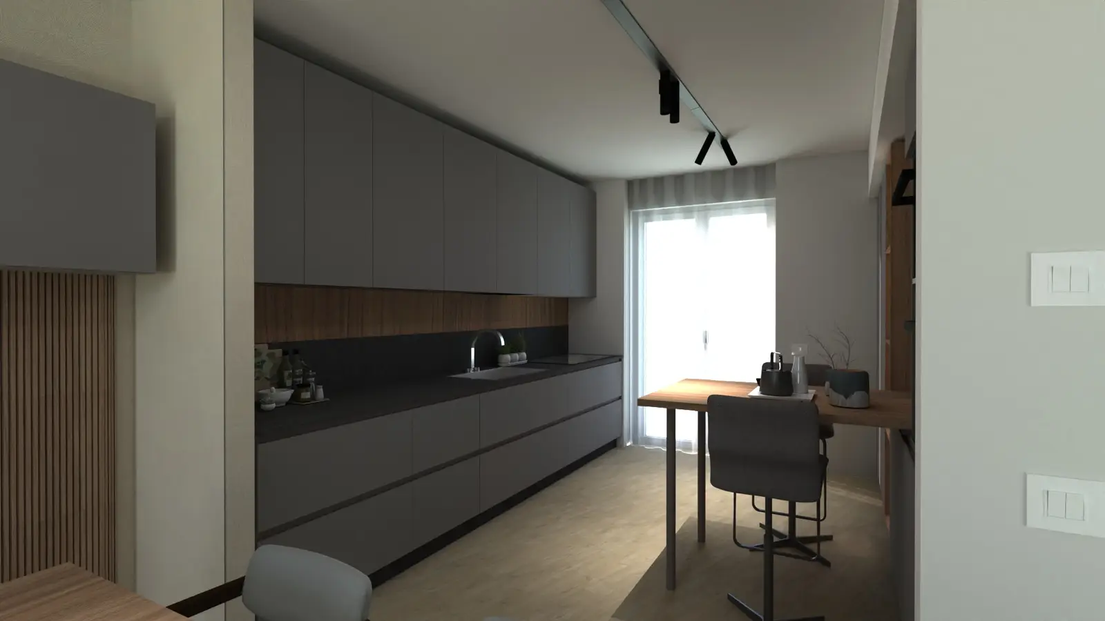 Vista della cucina lineare Valdesign con mobili su misura, finiture materiche e tavolo integrato progettati per un ambiente contemporaneo.